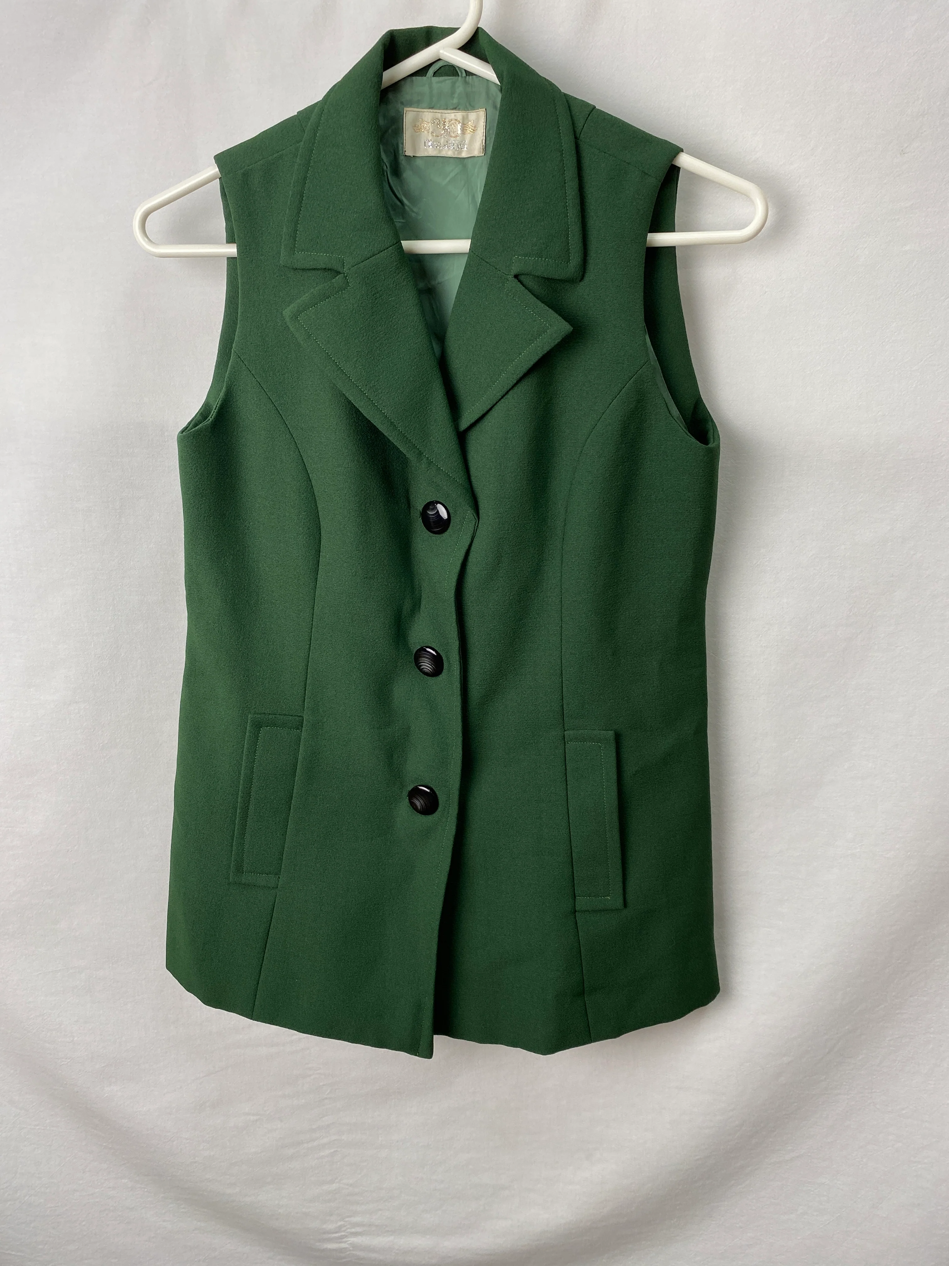 Womens Sleeveless Jacket Measures 32cm across shoulders, 70cm long